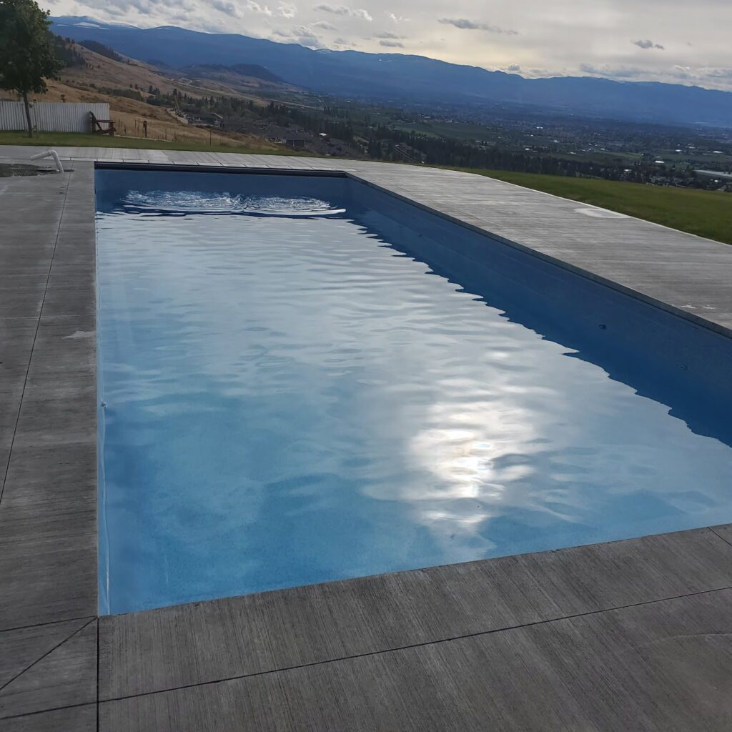 An amazing outdoor pool by builders Taylor Made Construction Thunder Bay